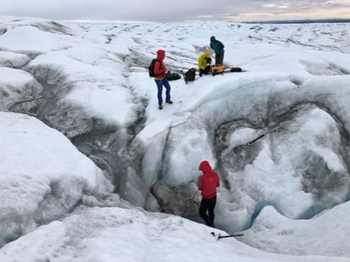 Researchers looking for methane in the air within crevices on the surface of the Greenland Ice Sheet. 